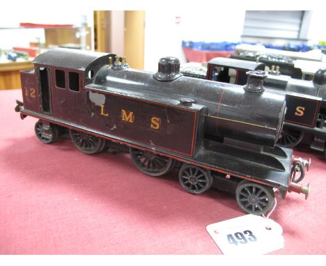 A 1930's 'O' Gauge 4-4-2 Tank Locomotive, three rail electric, finished in black LMS, running No. 12, believed to be Mills Br