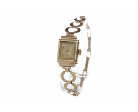 LADY'S MID TWENTIETH CENTURY NINE CARAT GOLD MANUAL WIND WRIST WATCHsigned Luvex movement, the rectangular dial with applied 