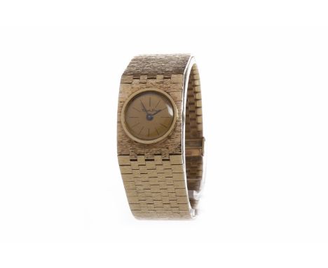 LADY'S BUECHE GIROD NINE CARAT GOLD MANUAL WIND WRIST WATCHunsigned 17 jewel movement, the round champagne coloured dial with