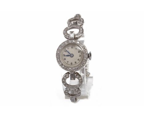 LADY'S EARLY TO MID TWENTIETH CENTURY DIAMOND SET MANUAL WIND COCKTAIL WATCHunsigned 17 jewel movement, the round white dial 