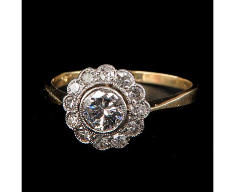 Set with 13 brilliant cut diamonds largest diamond is 0.5 carat ring size 19.