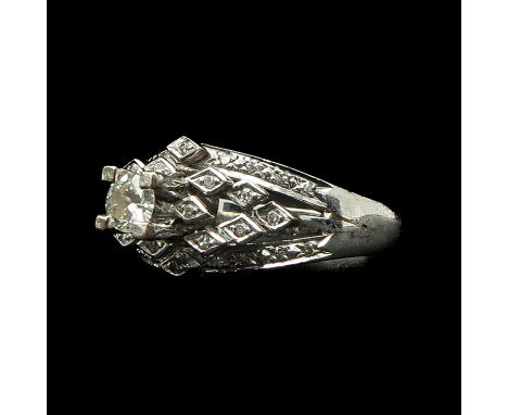 Largest diamond is approximately 0.25 carat ring size 17.