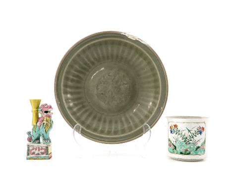 Including large celadon dish, candlestick, and brush pot, dish is 34 cm. in diameter, in diverse conditions.