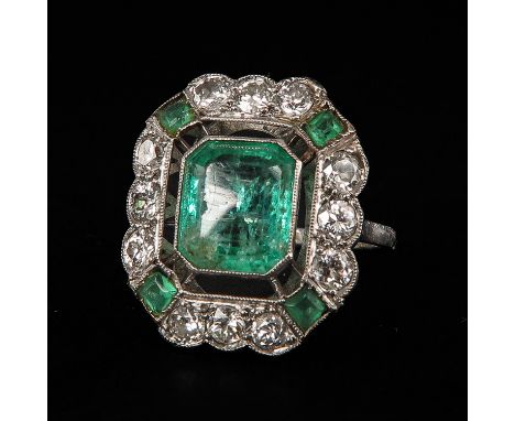 Circa 1910 - 1920 set with 12 brilliant cut diamonds and emeralds ring measures 18 x 20 mm. ring size 17.