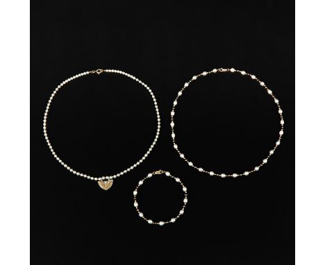 3 pieces 2 necklaces and 1 bracelet including 14KG diamonds and pearls largest pearl is 5 mm. in diameter.