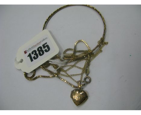 A 9ct Gold Bangle, of textured design, a 9ct gold box link chain, an engraved heart shape locket, on fine chain. (3)