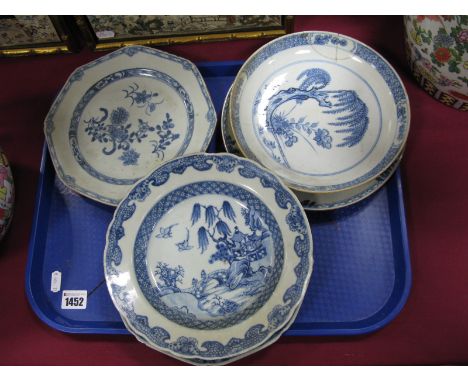 Oriental, four XIX Century Chinese garden scene pottery plates, a similar octagonal example decorated with floral sprigs, dam