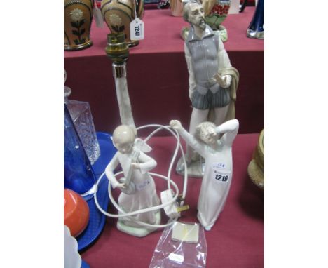 Lladro Boy In Nightgown, 22cm high; Nao Angel table lamp and (damaged) actor figure.