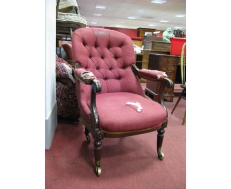 XIX Century Mahogany Tub Chair, with scroll hand rests, turned legs, brass castors, wine button back upholstery.