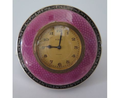A George V Silver and Pink Guilloché Enamel Strut Clock, Birmingham 1924, H.M., 8.5 cm diam., running, glass cracked and slig