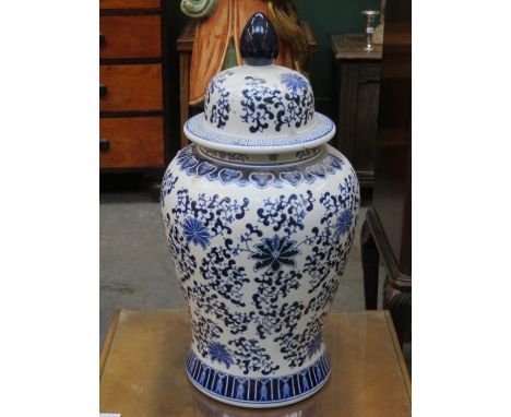 LARGE ORIENTAL STYLE BLUE AND WHITE CERAMIC JAR, APPROXIMATELY 64cm HIGH 