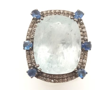 A 22.30ct Aquamarine Ring with a Halo of Diamonds and Kyanite Stones, Diamond weight approx 1ct and Kyanite 1ct, 925 silver. 