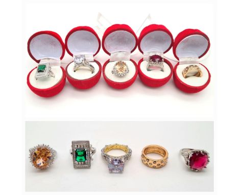 Five impressive looking dress rings with coloured gems, presented each in a red rose box. Ring sizes M-O 