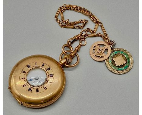 A Vintage 9K Gold Half-Hunter Pocket Watch - With a 9K Gold Fob. Also attached is a silver medal. Watch is in need of repair 