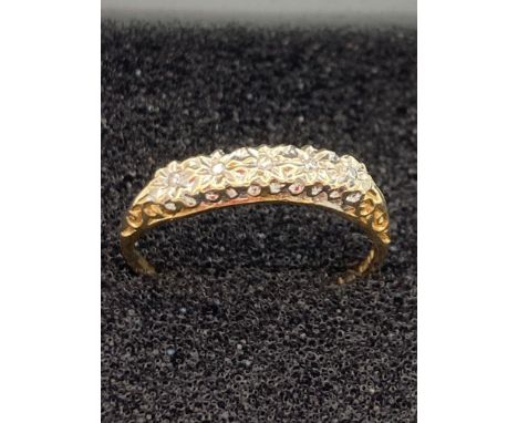 9 carat gold ring having five illusion set diamonds mounted to top.Size M. 