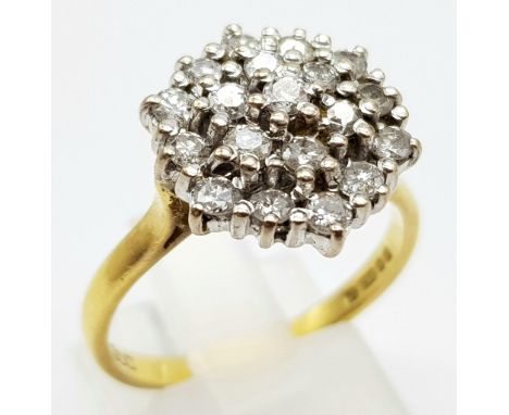 AN 18K GOLD 19 STONE DIAMOND CLUSTER RING WITH 1.5CT DIAMONDS. 5.4gms size R 