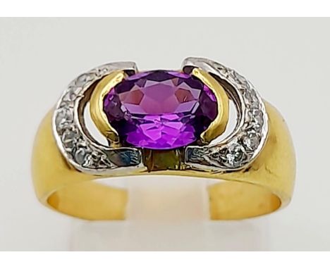 An 18K Yellow Gold Amethyst and Diamond Ring. Central clean amethyst surrounded by two arcs of diamonds. Size O. 5.68g total 