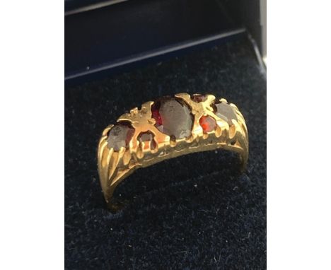 9 carat GOLD RING set with GARNETS. Small stone missing.2.6 grams. Size M 1/2 - N. 