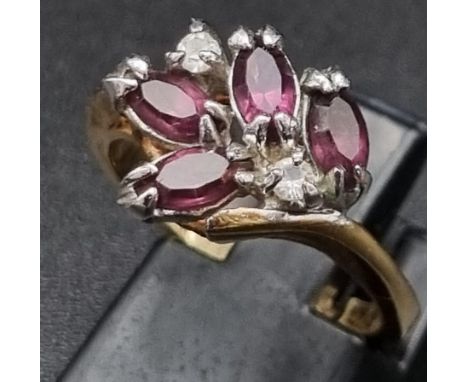 A gold plated ring with amethysts and cubic zirconia. Ring size: M 