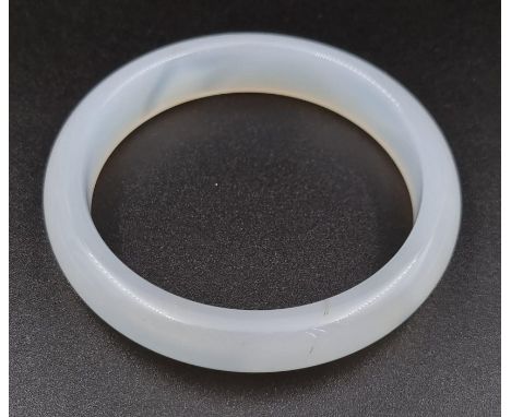 A Translucent Jade Bangle. 6cm inner diameter. 