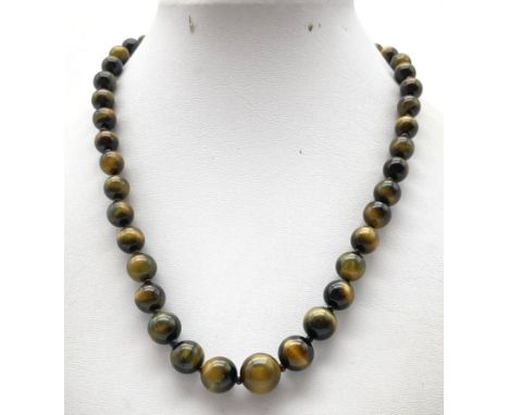 A Vintage Tigers Eye Graduated Necklace with a 14K Gold Clasp. 32.5g total weight 