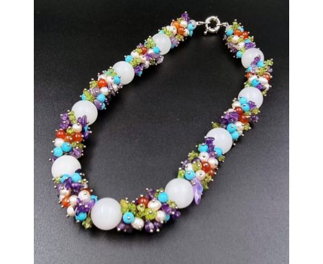 A Large White Jade Bead Necklace Interspersed with Pearls, Peridots, Amethysts and Turquoise Smaller Beads. 48cm 
