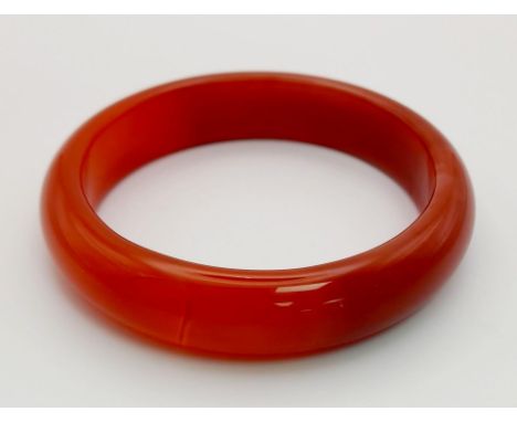 A Red Jade Bangle. Inner diameter - 6cm. 