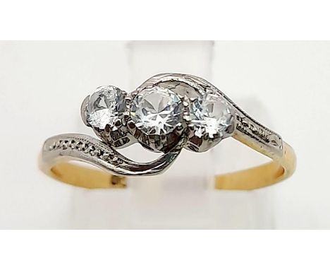 A 9K Yellow Gold Three-Stone Diamond Crossover Ring.Size M. 1.83g total weight. 