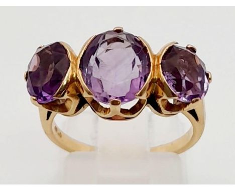 A Vintage 10K Rose-Gold Three-Stone Amethyst Ring.Size M. 4.5g total weight. 