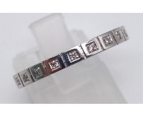 A 14K White Gold Diamond Half-Eternity Ring. 0.20ct. Size N. 3.71g. 