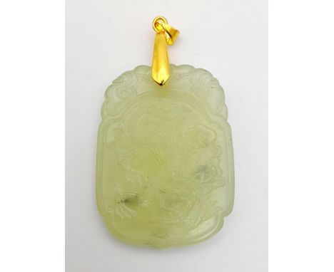 A Lime Green Jade Carved Decorative Pendant. length 4.5cm 