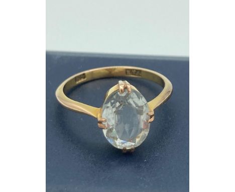 9 carat GOLD RING having AQUA solitaire mounted to top.2.3 grams. Size M 1/2. 