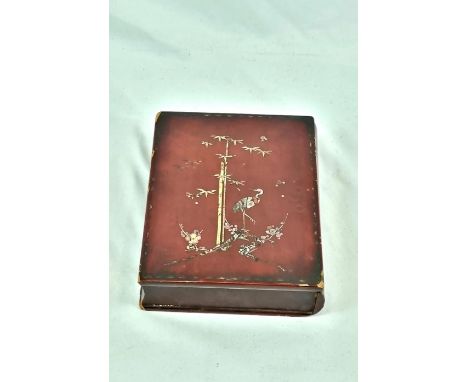 AN ANTIQUE MOTHER OF PEARL INLAID BOOK TRINKET BOX WITH BAMBOO PLANT AND CRANE IMAGES A/F18 X 24cms 