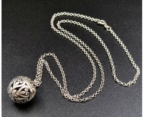 A Vintage Silver Pierced Ball Pendant (opens at centre) on a Silver Chain. 18mm and 60cm. 11.85g 