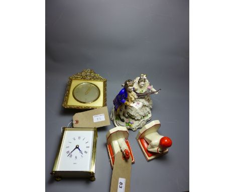 A collection of items including a pair of Art Deco ceramic bookends, an Elliott clock, a carriage clock and other items