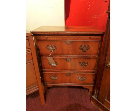A 20th Century walnut bedside chest of three drawers, raised on carved bracket feet. H-72cm, W-62cm, D-32cm