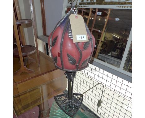 An Art Nouveau style wrought iron table lamp with leaf decoration and orange shade H 57cm 
