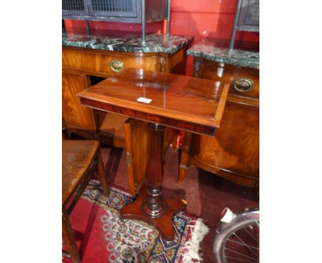 A flame mahogany rectangular wine table raised on fluted support and quad base H:74cm D:44cm D:34cm 