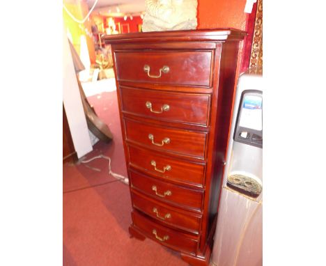 A mahogany pedestal chest of seven drawers, raised on carved bracket feet.H-121cm, W-51cm, D-38cm