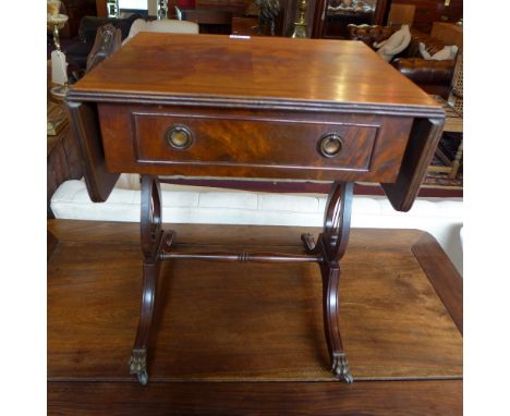 A mahogany drop leaf sofa table with single drawer raised on paw feet and castors H 53cm 