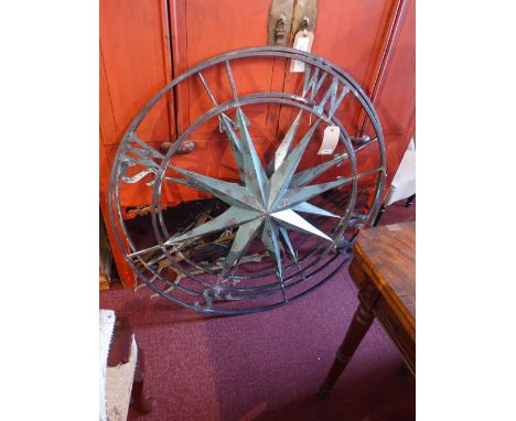 A pair of painted distressed metal wall mounted compass design sculpture H:105cm W:105cm