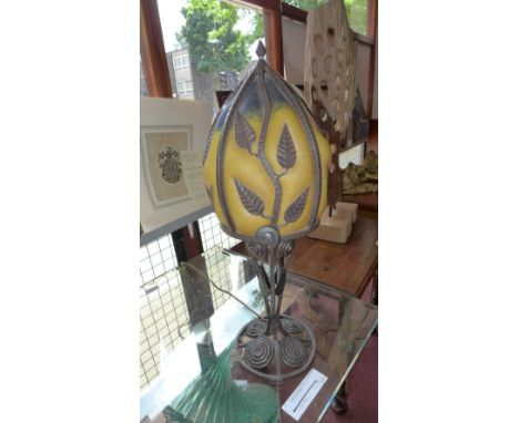 An Art Nouveau style wrought iron table lamp with leaf decoration and yellow shade H 56cm 