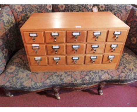 A oak bank of fifteen drawers for storing wine. H-42cm, W-82cm, D-46cm