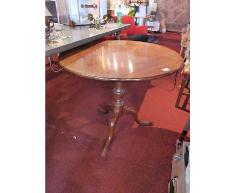 A 19th Century mahogany circular tilt table, raised on tripod base. H-70cm, Diameter 80cm 