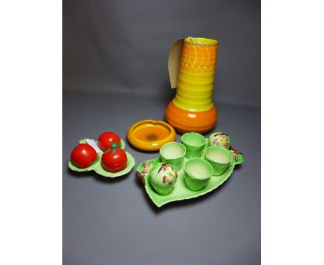 A Shelley orange and yellow glazed vase and ashtray together with a Carlton Ware egg cup and cruet set and one other Carlton 