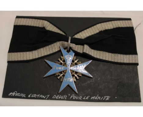 A copy Imperial German Pour le Merite enamelled bravery medal with ribbon