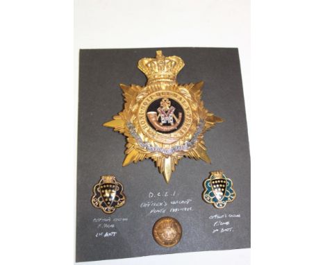 A Victorian Officer's silver gilt helmet plate of the Duke of Cornwall's Light Infantry together with 1st and 2nd Battalion O
