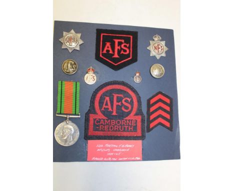 A selection of Auxiliary Fire Service badges and insignia formerly the property of Leading Fireman T. H. Perry, Camborne 1939