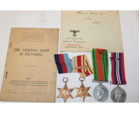 A 1939/45 Star, Africa Star with 8th Army bar, Defence medal and 1939-45 War medal together with a pamphlet "The German Army 