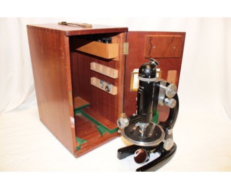 A monocular microscope by J Swift &amp; Sons London in fitted mahogany case with accessories